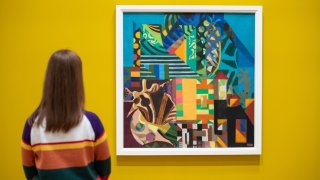 A woman views an artwork at the “Eileen Agar: Angel Of Anarchy” exhibition At Whitechapel Gallery on May 14, 2021, in London, U.K. Art experts recommend people visit galleries to hone their taste before investing.