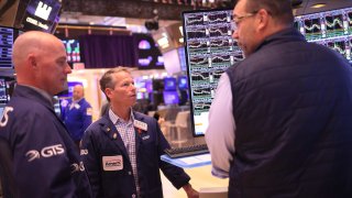 Traders work on the floor of the New York Stock exchange during morning trading on November 10, 2023 in New York City.