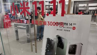 YICHANG, CHINA – OCTOBER 29, 2023 – Customers experience Mi 14 series phones at a Xiaomi store in Yichang, Hubei province, China, Oct 29, 2023. (Photo by Costfoto/NurPhoto via Getty Images)
