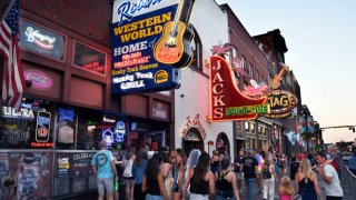 Tourists visit the bars and country music venues in the Lower Broadway entertainment district in Nashville, Tennessee, Sept. 1, 2019.