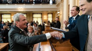 FILE – New Jersey Gov. Phil Murphy meets with Senate President Nicholas Scutari, right, and Assembly Speaker Craig Coughlin, second right, before he delivers his State of the State address to a joint session of the Legislature at the statehouse, in Trenton, N.J., Tuesday, Jan. 10, 2023. New Jersey wraps up voting Tuesday, Nov. 7, 2023, for a new Legislature, with all 120 seats on the ballot, as Republicans fight for controlling either chamber for the first time in more than two decades. (AP Photo/Matt Rourke, File)