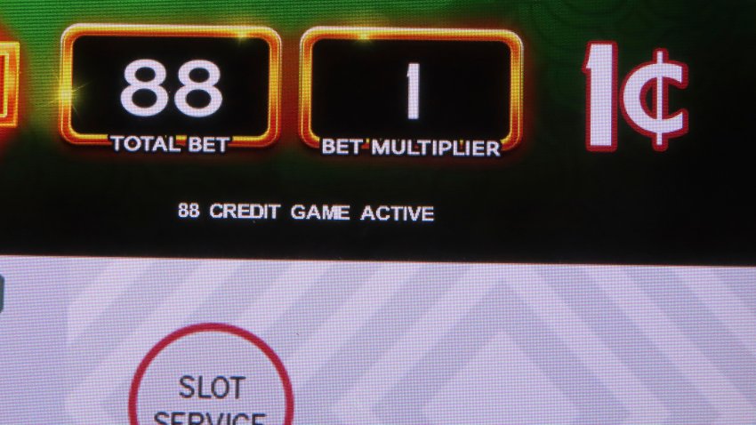The screen of a penny slot machine is displayed at Harrah’s casino in Atlantic City, N.J., Sept. 29, 2023. On Nov. 14, 2023 New Jersey gambling regulators released details of forfeitures they ordered totaling over $77,000 from five casinos and a racetrack that were found to have allowed underage or otherwise prohibited gamblers to make bets. (AP Photo/Wayne Parry)