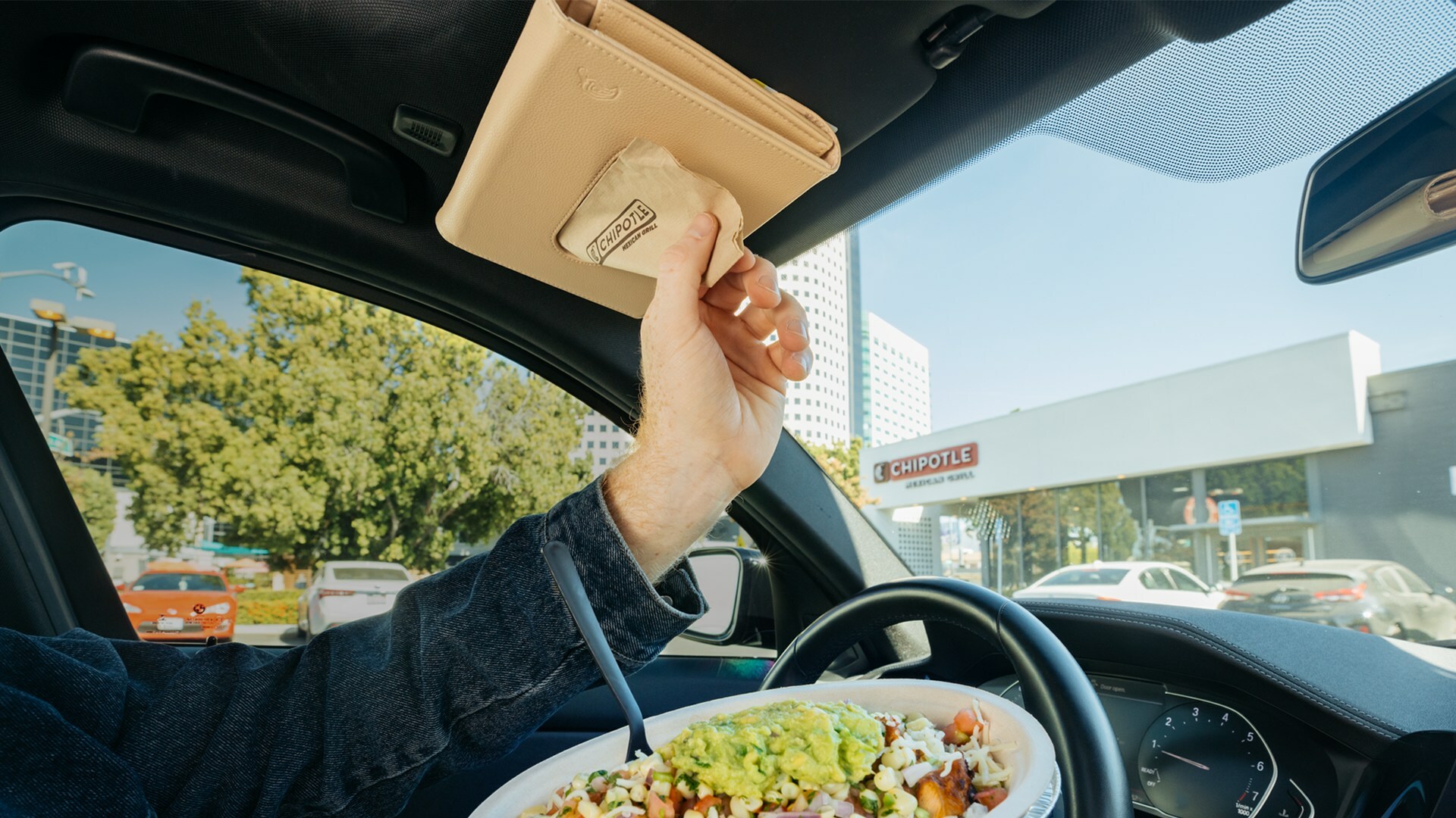 Chipotle created a limited edition vegan cactus leather Car Napkin Holder inspired by fans who stash stacks of Chipotle napkins in their car.