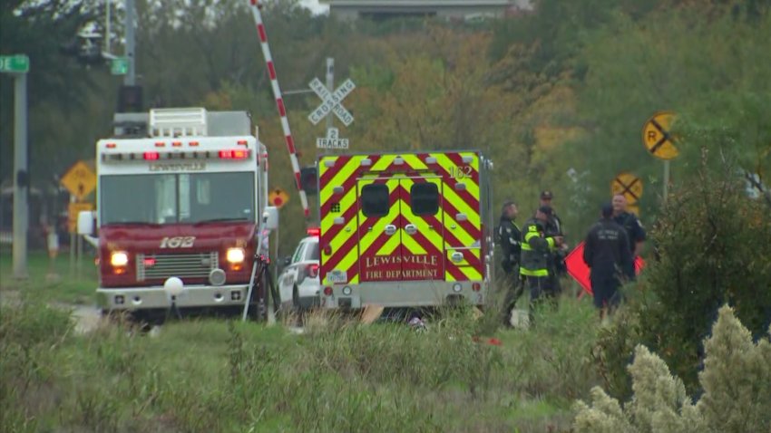 Lewisville Fire responds to a call about a vehicle being driven into a retention pond, on Friday, Nov. 17, 2023.