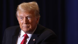 Republican presidential candidate, former President Donald Trump arrives at a campaign event at the Hyatt Hotel on December 13, 2023 in Coralville, Iowa. 