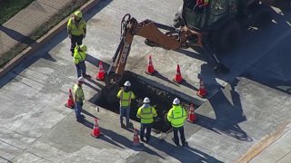 Crews look at hole on Route 202