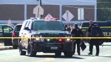 Austin ISD Police gather outside Northeast Early College High School after an officer was shot Tuesday, Dec. 5, 2023.