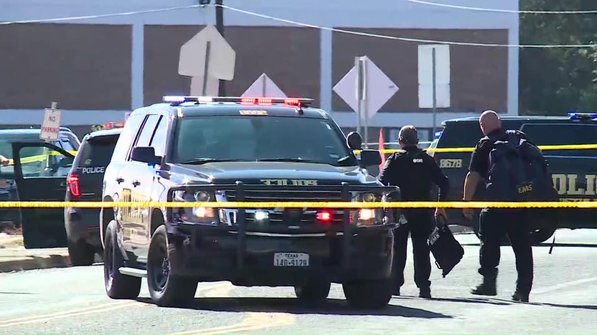 Austin ISD Police gather outside Northeast Early College High School after an officer was shot Tuesday, Dec. 5, 2023.