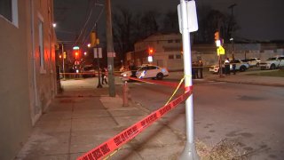 Police tape off scene where a 22-year-old man was shot and killed in North Philly on Thursday