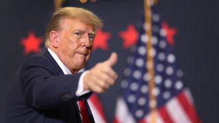 Former U.S. President Donald Trump looks on during a campaign event in Waterloo, Iowa, on Dec. 19, 2023.