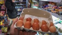 A customer holds a pack of chicken eggs in a shop in Moscow on December 11, 2023. A surge in egg prices, against a backdrop of high inflation and economic sanctions, is worrying the Russian authorities, especially since they constitute a central ingredient for the end-of-year celebrations. Egg prices increased in November by 40.29% year-on-year, according to the Russian Statistics Agency (Rosstat), exceeding 100 rubles (around 1 euro) per ten in several Russian regions, an unprecedented increase. (Photo by Alexander NEMENOV / AFP) (Photo by ALEXANDER NEMENOV/AFP via Getty Images)