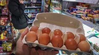 A customer holds a pack of chicken eggs in a shop in Moscow on December 11, 2023. A surge in egg prices, against a backdrop of high inflation and economic sanctions, is worrying the Russian authorities, especially since they constitute a central ingredient for the end-of-year celebrations. Egg prices increased in November by 40.29% year-on-year, according to the Russian Statistics Agency (Rosstat), exceeding 100 rubles (around 1 euro) per ten in several Russian regions, an unprecedented increase. (Photo by Alexander NEMENOV / AFP) (Photo by ALEXANDER NEMENOV/AFP via Getty Images)