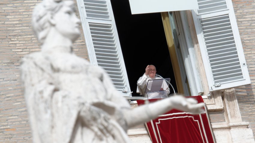 Pope looking out window of the Apostolic Palace