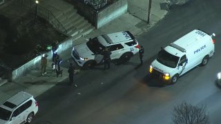 Police investigate after a 14-year-old boy was shot just a block from his home in West Philadelphia on Monday night.