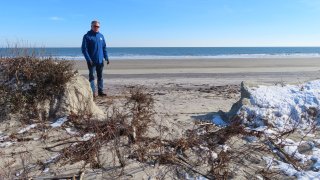 Mayor Patrick Rosenello stands next to a destroyed section of sand dune in North Wildwood N.J. on Jan. 22, 2024.