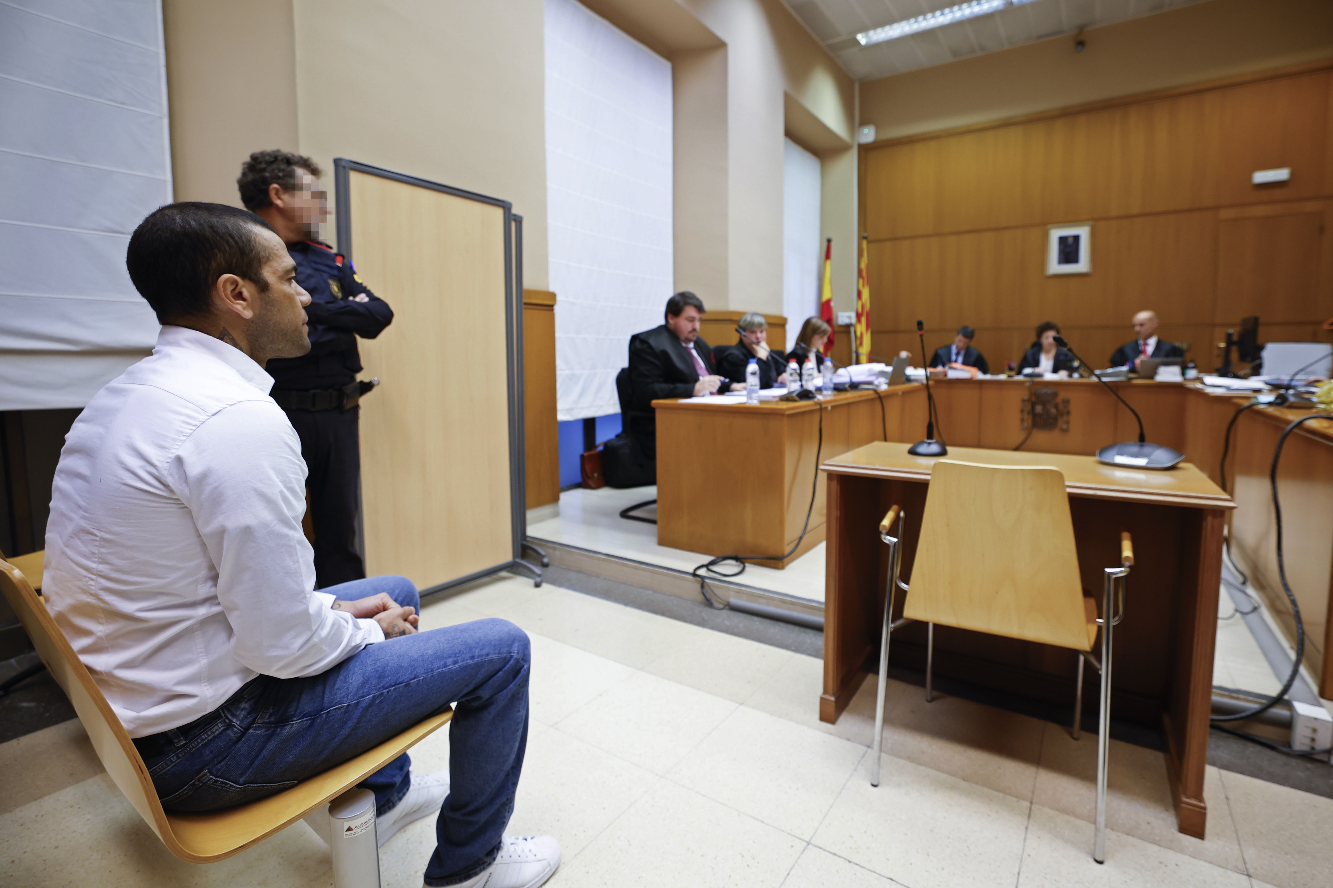 Brazilian soccer star Dani Alves sits during his trial in Barcelona.