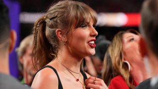 Taylor Swift watches the celebration on the field after the NFL Super Bowl 58