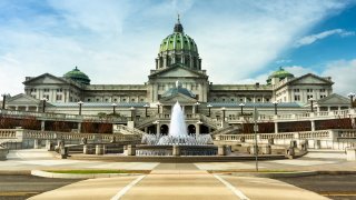 Building exterior and fountain of the Pennsylvania State Capitol building in downtown Harrisburg U-S-A.
