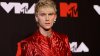 See Machine Gun Kelly's transformation after covering his tattoos with solid black ink