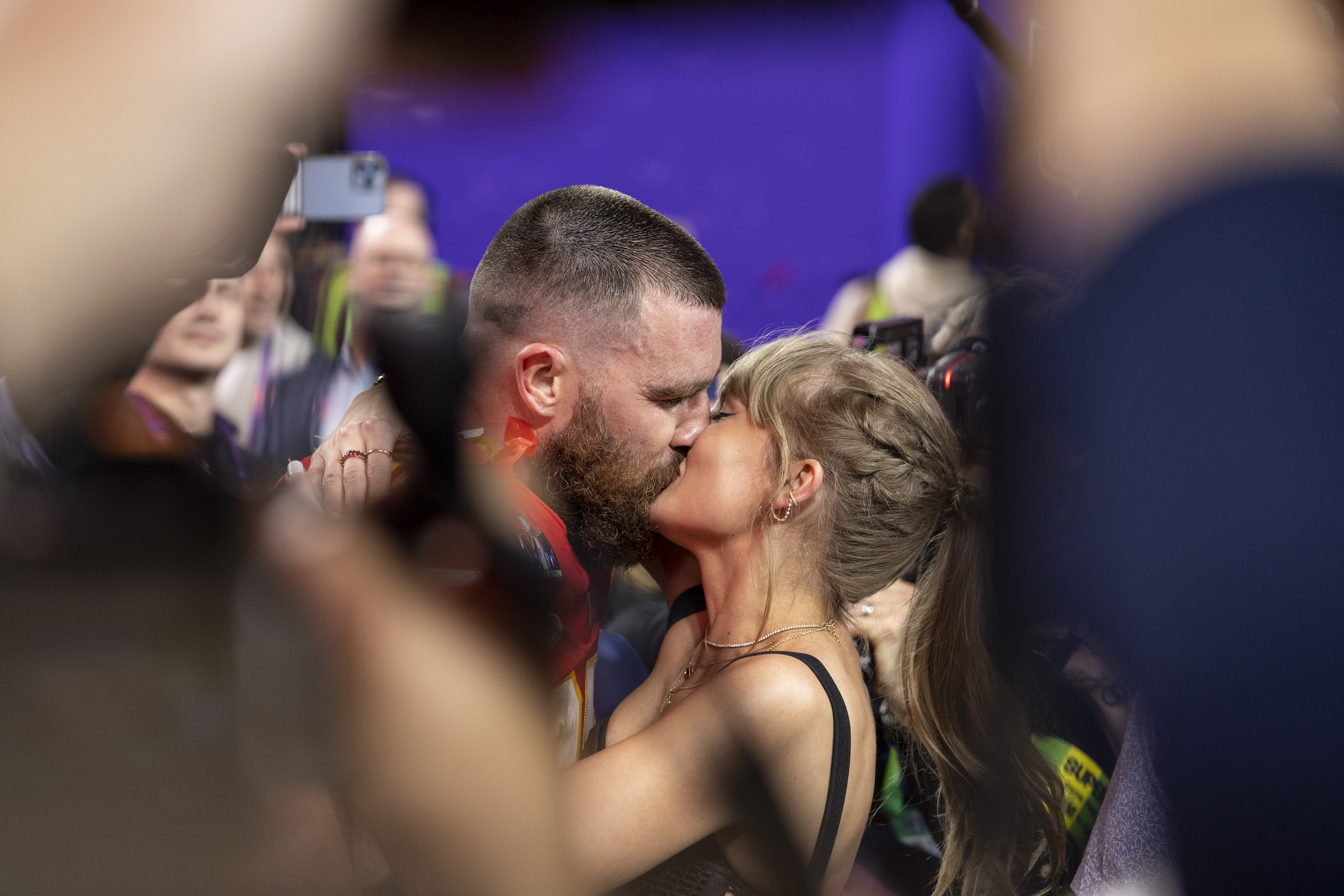 LAS VEGAS, NEVADA - FEBRUARY 11: Travis Kelce #87 of the Kansas City Chiefs celebrates and kisses Singer Taylor Swift following the NFL Super Bowl 58 football game between the San Francisco 49ers and the Kansas City Chiefs at Allegiant Stadium on February 11, 2024 in Las Vegas, Nevada. (Photo by Michael Owens/Getty Images)