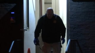 investigators entering home