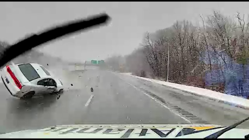 Dash camera footage from Cataldo Ambulance Service shows a dramatic rollover crash that just missed an ambulance that was transporting a patient.