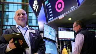 Traders work on the floor at the New York Stock Exchange (NYSE) in New York City, U.S., March 5, 2024.