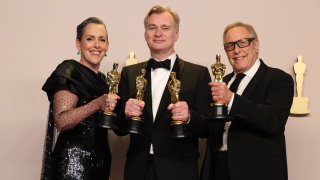 (L-R) Emma Thomas, Christopher Nolan and Charles Roven, winners of the Best Picture award for “Oppenheimer”, pose in the press room during the 96th Annual Academy Awards at Ovation Hollywood on March 10, 2024 in Hollywood, California. (Photo by John Shearer/WireImage)