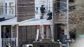Police surround a home where Andre Gordon Jr. was believed to be in Trenton, N.J., on Saturday, March 16, 2024.