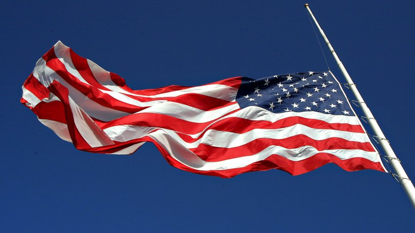 American flag flying at half mast