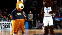 PORTLAND, OREGON - MARCH 17: The mascots of the UCLA Bruins and the Akron Zips dance during the first round game of the 2022 NCAA Men's Basketball Tournament at Moda Center on March 17, 2022 in Portland, Oregon. (Photo by Ezra Shaw/Getty Images)