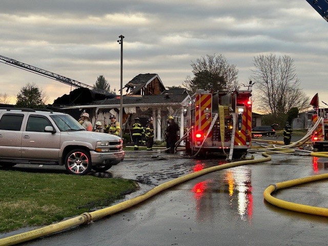 Firetruck outside burned clubhouse