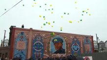 Balloons released above mural of slain Philadelphia Police Sgt. Robert Wilson III.