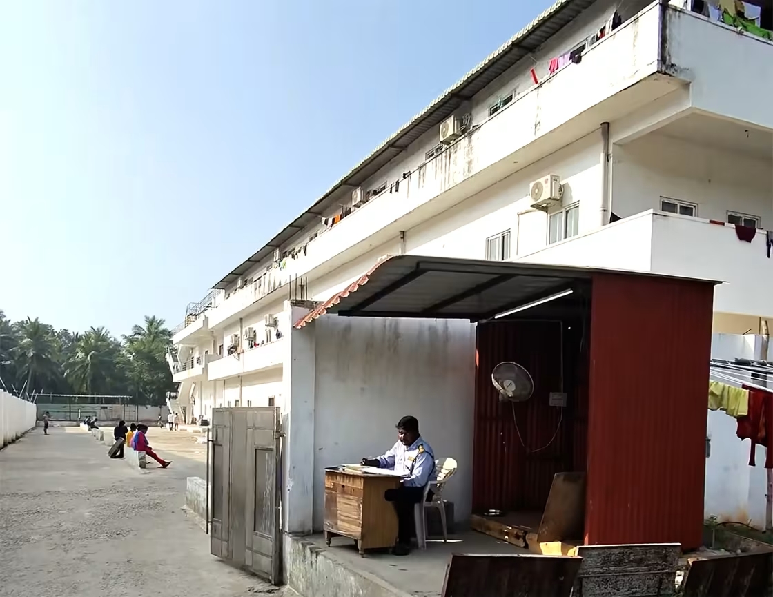 A uniformed security guard stationed at a Choice Canning shrimp processing plant in Amalapuram, India, in February.