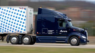 A self-driving tractor trailer maneuvers around a test track in Pittsburgh, Thursday, March 14, 2024. The truck is owned by Pittsburgh-based Aurora Innovation Inc.