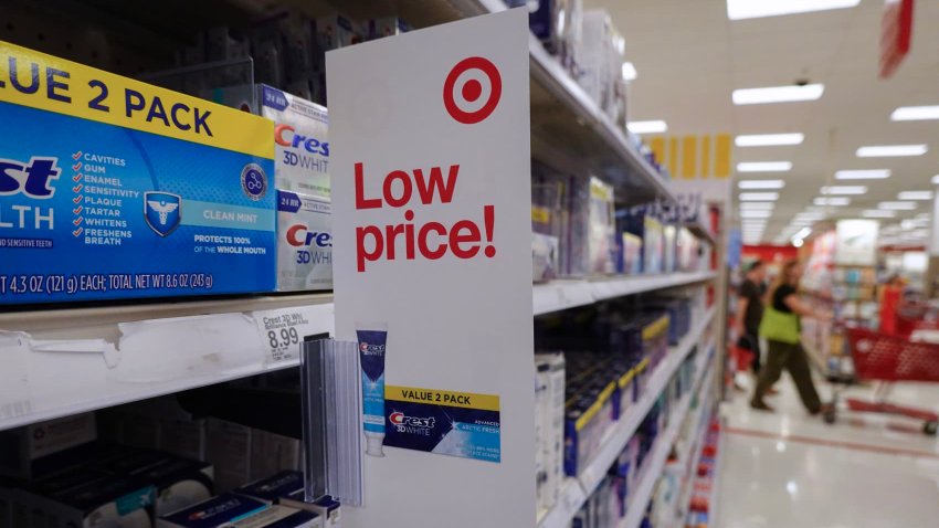 A “low price” sign hangs from a shelf at a Target store in Miami, Florida, on May 20, 2024.