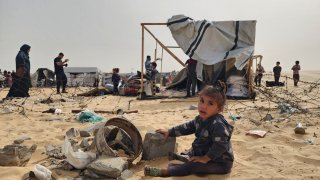 A Palestinian child plays with the rubble after Israel bombs Palestinians’ tents and shelters in Rafah, Gaza, on May 27, 2024.