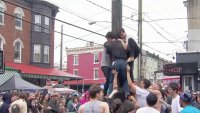 ‘It's a sport': People climb greased pole at South Philly Italian Market Festival