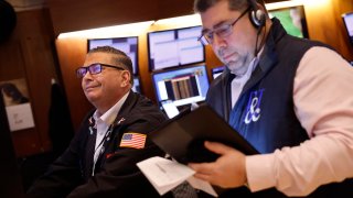 Traders work on the floor of the New York Stock Exchange during morning trading on Feb. 14, 2024 in New York City.