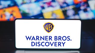 In this photo illustration, the Warner Bros. Discovery logo is displayed on a smartphone screen.