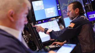 Traders work on the floor of the New York Stock Exchange during morning trading on May 31, 2024 in New York City. 