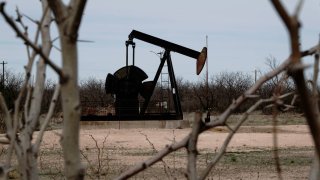 A pump jack drills oil crude from the Yates Oilfield in West Texas’s Permian Basin, near Iraan, Texas, U.S., March 17, 2023. 