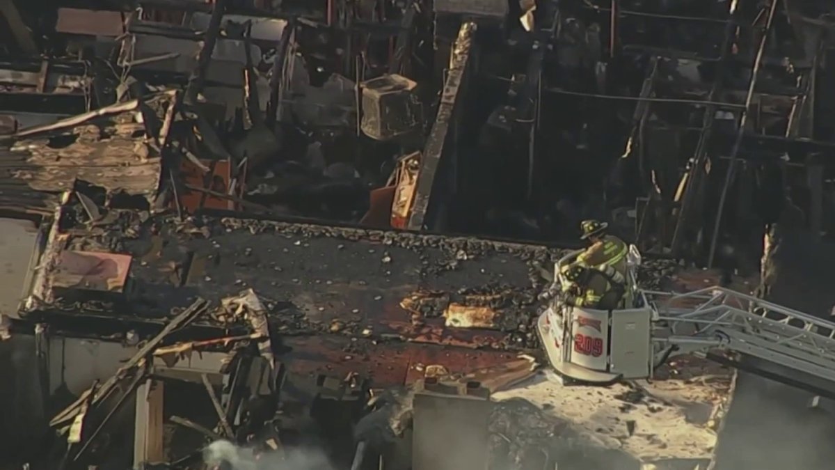 Dozens of residents displaced after fire rips through an apartment ...