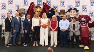 Philadelphia college basketball mascots with officials.