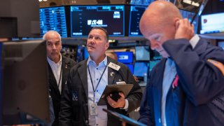 Traders work on the floor of the New York Stock Exchange on June 18, 2024.