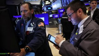 Traders work on the floor of the New York Stock Exchange in New York City, June 24, 2024.