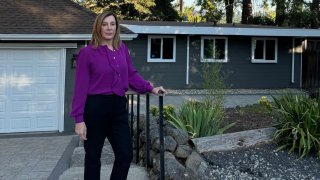 Rana Robillard, an Oakland-based tech executive, in front of the home in Orinda, CA that she attempted to purchase earlier this year.