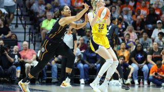 Connecticut Sun forward Brionna Jones (left) and Los Angeles Sparks forward Cameron Brink (22) fight for ball possession during a WNBA game between the Sparks and the Sun on June 18, 2024, at Mohegan Sun Arena in Uncasville, CT.