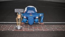 Kyle Larson kisses the bricks