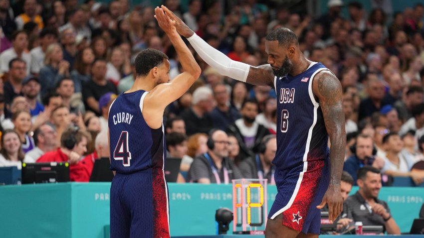 Stephen Curry and LeBron James of Team USA high five